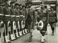His Majesty Inspecting The Guard Of Honour Of The Black Watch At Perth in August, 1935. Creator: Unknown