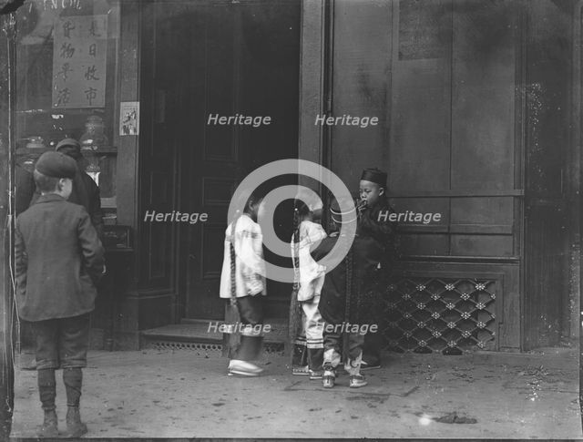 His first cigar, Chinatown, San Francisco, between 1896 and 1906. Creator: Arnold Genthe.