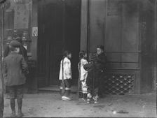 His first cigar, Chinatown, San Francisco, between 1896 and 1906. Creator: Arnold Genthe