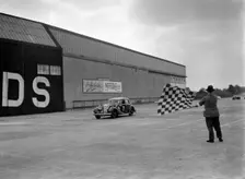 HJ Ripley's SS Jaguar taking the chequered flag, MCC Members Meeting, Brooklands, 10 September 1938. Artist: Bill Brunell