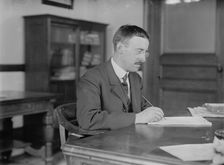 H.L. Stimson at desk writing, 1910. Creator: Bain News Service