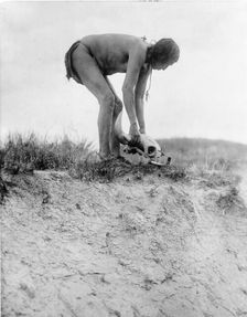 Hu ka-lowa pifire-carrier bringing the skull, c1908. Creator: Edward Sheriff Curtis