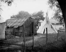 Hut and tepee, probably St. Clair Flats, Mich., between 1900 and 1920. Creator: Unknown