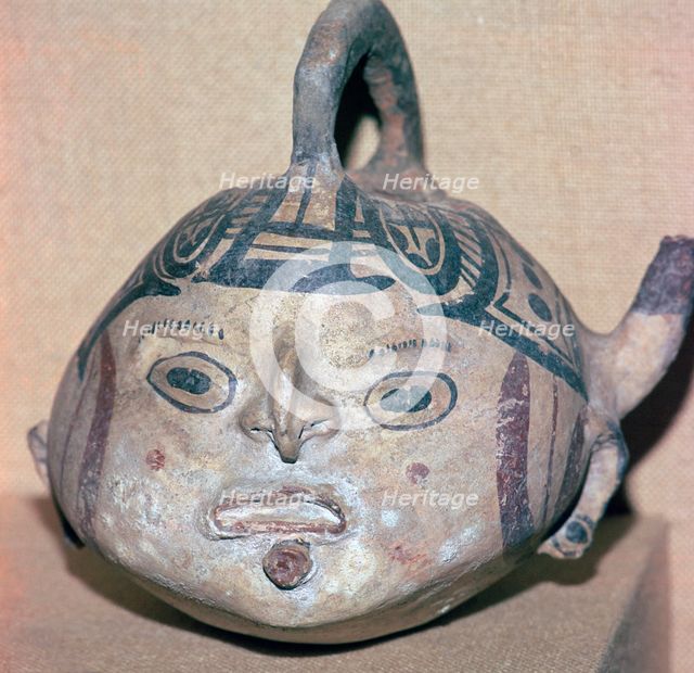 Huaxtec culture spouted jug painted with a human face. Artist: Unknown