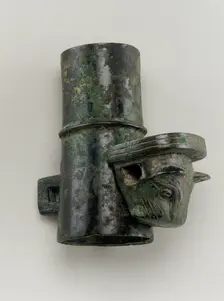 Hubcap with linchpin cast in the form of a feline head, Zhou dynasty, 1050-221 BCE. Creator: Unknown