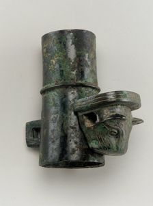 Hubcap with linchpin cast in the form of a feline head, Zhou dynasty, 1050-221 BCE. Creator: Unknown