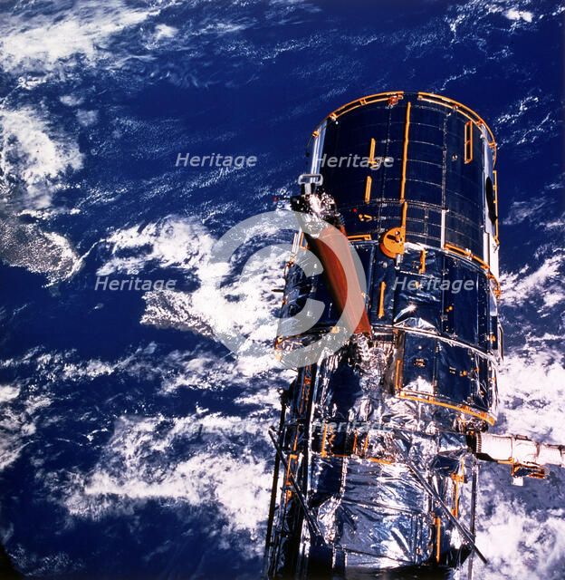 Hubble Space Telescope above the Earth. Artist: Unknown