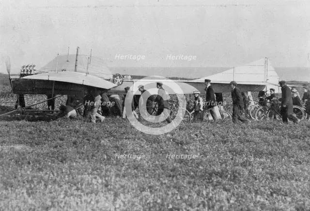 Hubert Latham prepares to take off after Louis Bleriot, near Calais, France, 25 July 1909. Artist: Unknown