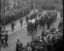 Huge Crowds Watching the Funeral Procession of Terence MacSwiney. His Coffin Is Draped..., 1920. Creator: British Pathe Ltd