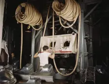 Huge drop hammers work day and night form...North American Aviation, Inc., Inglewood, Calif. , 1942. Creator: Alfred T Palmer