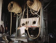 Huge drop hammers work day and night form...North American Aviation, Inc., Inglewood, Calif. , 1942. Creator: Alfred T Palmer