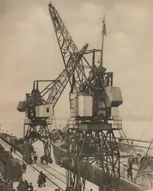 Huge Mobile Cranes at Tilbury Swing the Cargo from a Vessel's Hold c1935. Creator: Unknown