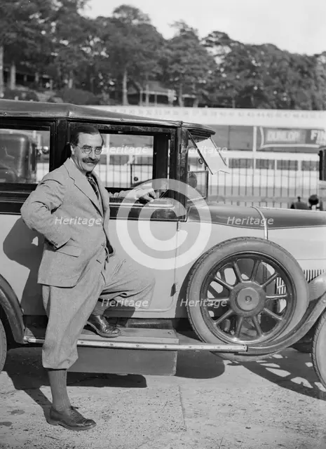 Hugh McConell beside a car, Brooklands, 3 August 1931. Artist: Bill Brunell.