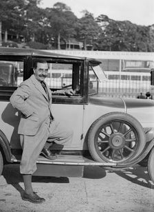 Hugh McConell beside a car, Brooklands, 3 August 1931. Artist: Bill Brunell