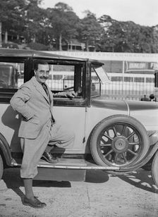 Hugh McConell beside a car, Brooklands, 3 August 1931. Artist: Bill Brunell