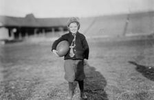 Hughey Gold [child with football], between c1910 and c1915. Creator: Bain News Service