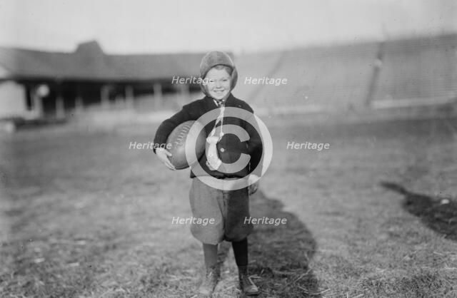 Hughey Gold [child with football], between c1910 and c1915. Creator: Bain News Service.