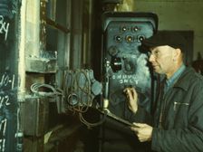Hump master in a Chicago and North Western railroad yard operating a signal..., Chicago, Ill., 1942. Creator: Jack Delano