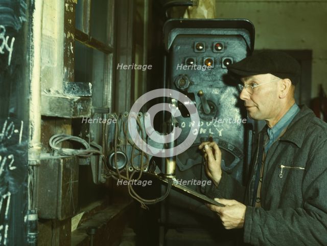Hump master in a Chicago and North Western railroad yard operating a signal..., Chicago, Ill., 1942. Creator: Jack Delano.