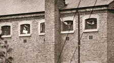 Hunger strikers waving to Christabel Pankhurst from their cells in Holloway Prison, London, 1909. Creator: Unknown