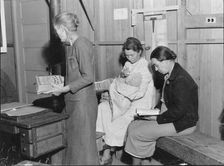 Hymn singing at meeting of Mothers Club in Arvin migrant camp, California, 1938. Creator: Dorothea Lange