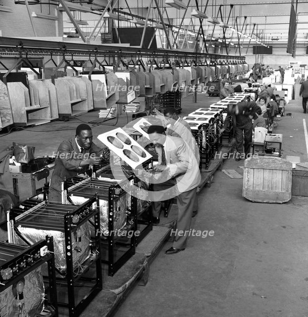 Immigrant workers on the cooker production line at the GEC, Swinton, South Yorkshire, 1962. Creator: Michael Walters.