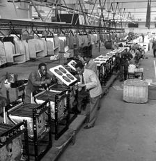 Immigrant workers on the cooker production line at the GEC, Swinton, South Yorkshire, 1962. Creator: Michael Walters