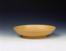 Imperial yellow glazed saucer, Yongzheng period, Qing dynasty, China, 1723-1735. Creator: Unknown