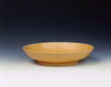 Imperial yellow glazed saucer, Yongzheng period, Qing dynasty, China, 1723-1735. Creator: Unknown