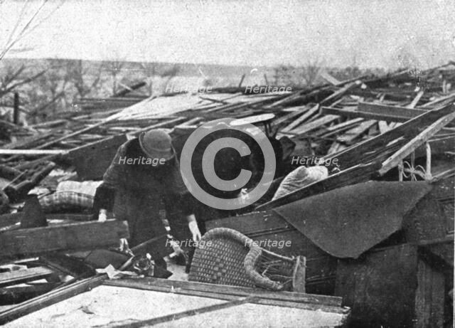 In Canada: The Halifax Explosion; People search among the ruins of their houses, 1917. Creator: Unknown.