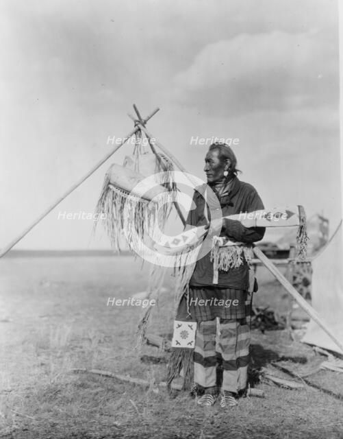 In a Blackfoot camp, c1927. Creator: Edward Sheriff Curtis.