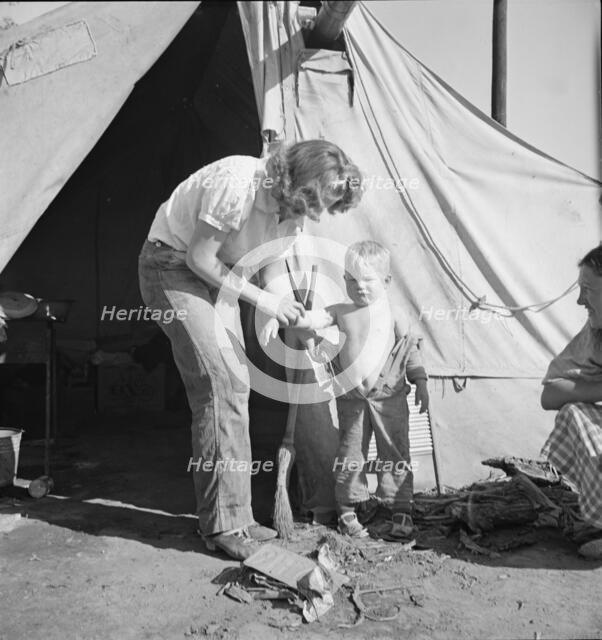 In a carrot pullers' camp near Holtville, California, 1939. Creator: Dorothea Lange.