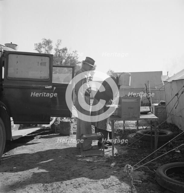 In a carrot pullers' camp near Holtville, Imperial Valley, California, 1939. Creator: Dorothea Lange.