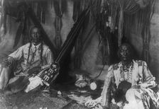 In a Piegan lodge, c1910. Creator: Edward Sheriff Curtis