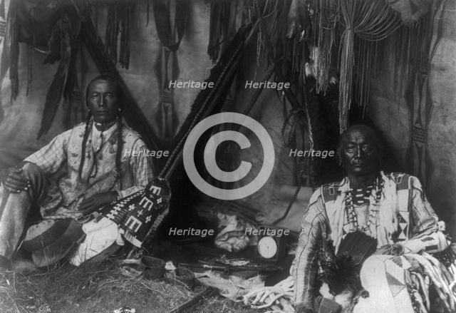 In a Piegan lodge, c1910. Creator: Edward Sheriff Curtis.