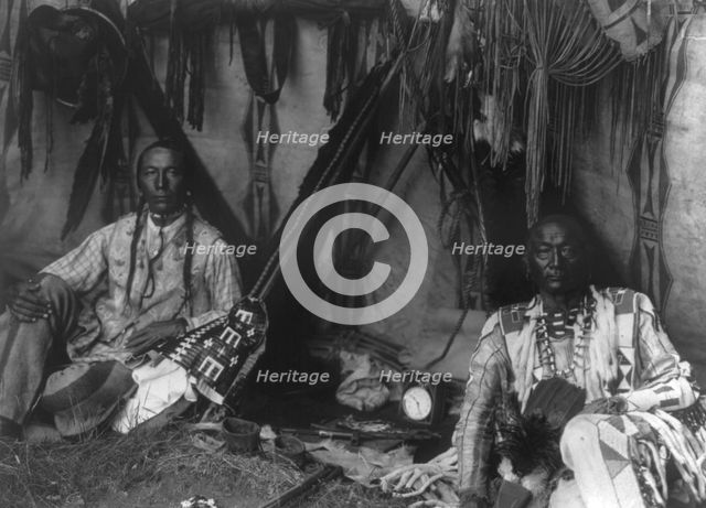 In a Piegan lodge, c1910. Creator: Edward Sheriff Curtis.