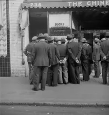 In front of the local paper of San Francisco's Chinatown, 1938. Creator: Dorothea Lange