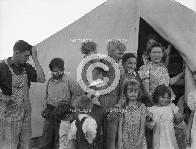 In FSA migrant labor camp during pea harvest, Brawley, Imperial County, California, 1939. Creator: Dorothea Lange.
