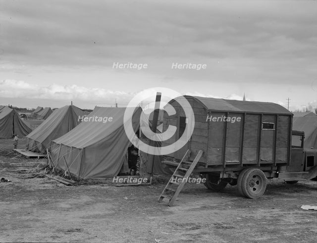 In mobile camp at end of season, cold day, FSA camp, Merrill, Klamath County, Oregon, 1939. Creator: Dorothea Lange.