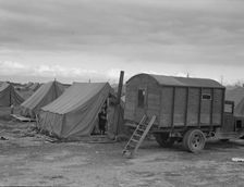In mobile camp at end of season, cold day, FSA camp, Merrill, Klamath County, Oregon, 1939. Creator: Dorothea Lange