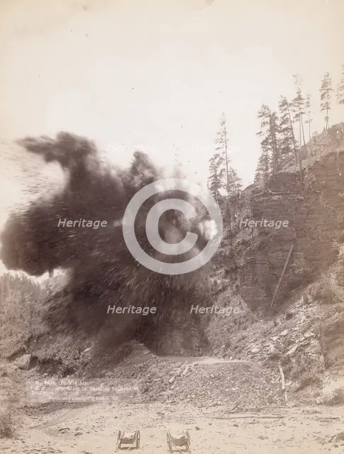 In mid air A wonderful blast in building railroad to Deadwood, 1890. Creator: John C. H. Grabill.