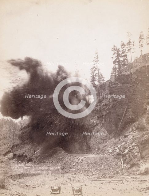 In mid air A wonderful blast in building railroad to Deadwood, 1890. Creator: John C. H. Grabill.