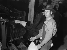 In packing shed, grading and sacking potat..., Tulelake, Siskiyou County, California, 1939 Creator: Dorothea Lange