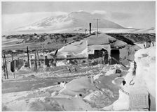 In Winter Quarters Working on Maps and Records Antarctica, 1911-1912. Creator: Herbert Ponting