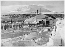 In Winter Quarters Working on Maps and Records Antarctica, 1911-1912. Artist: Herbert Ponting