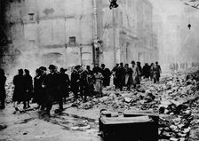 In the morning, work as usual. After a big raid, the way to the office is knee-deep in rubble. Lond