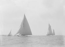 In the foreground the 23-metre cutter Astra sailing on a reach. Creator: Kirk & Sons of Cowes