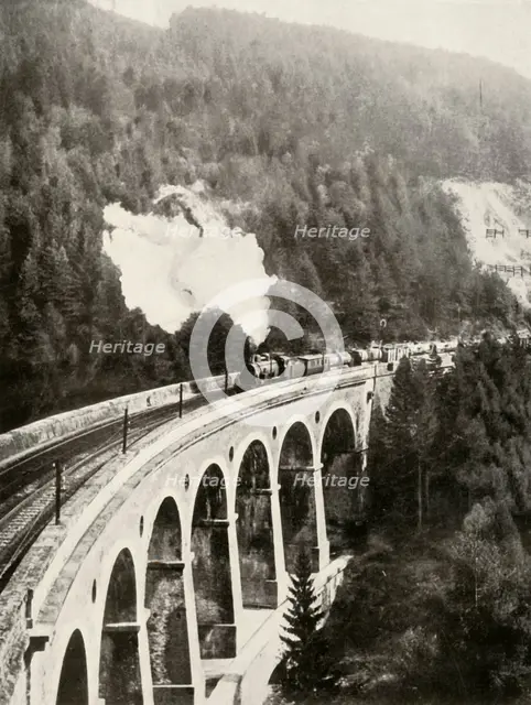 'In the Semmering Valley, Austria. A good train crossing the curved Gamperl Viaduct', 1935-36. Creator: Unknown.