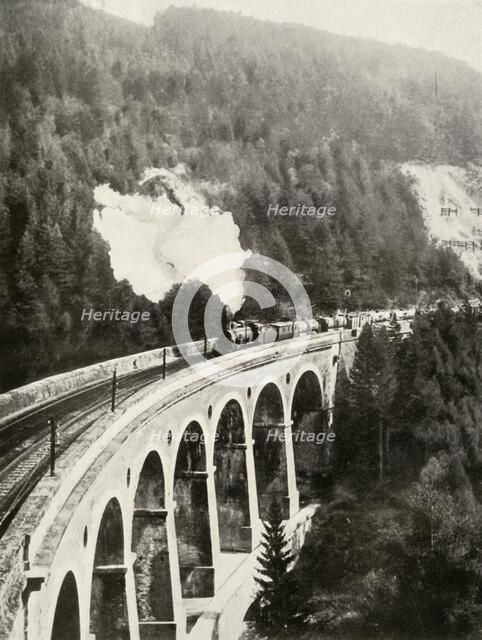 'In the Semmering Valley, Austria. A good train crossing the curved Gamperl Viaduct', 1935-36. Creator: Unknown.