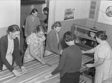 In the sewing room, Shafter camp for migrants (FSA), California, 1938. Creator: Dorothea Lange